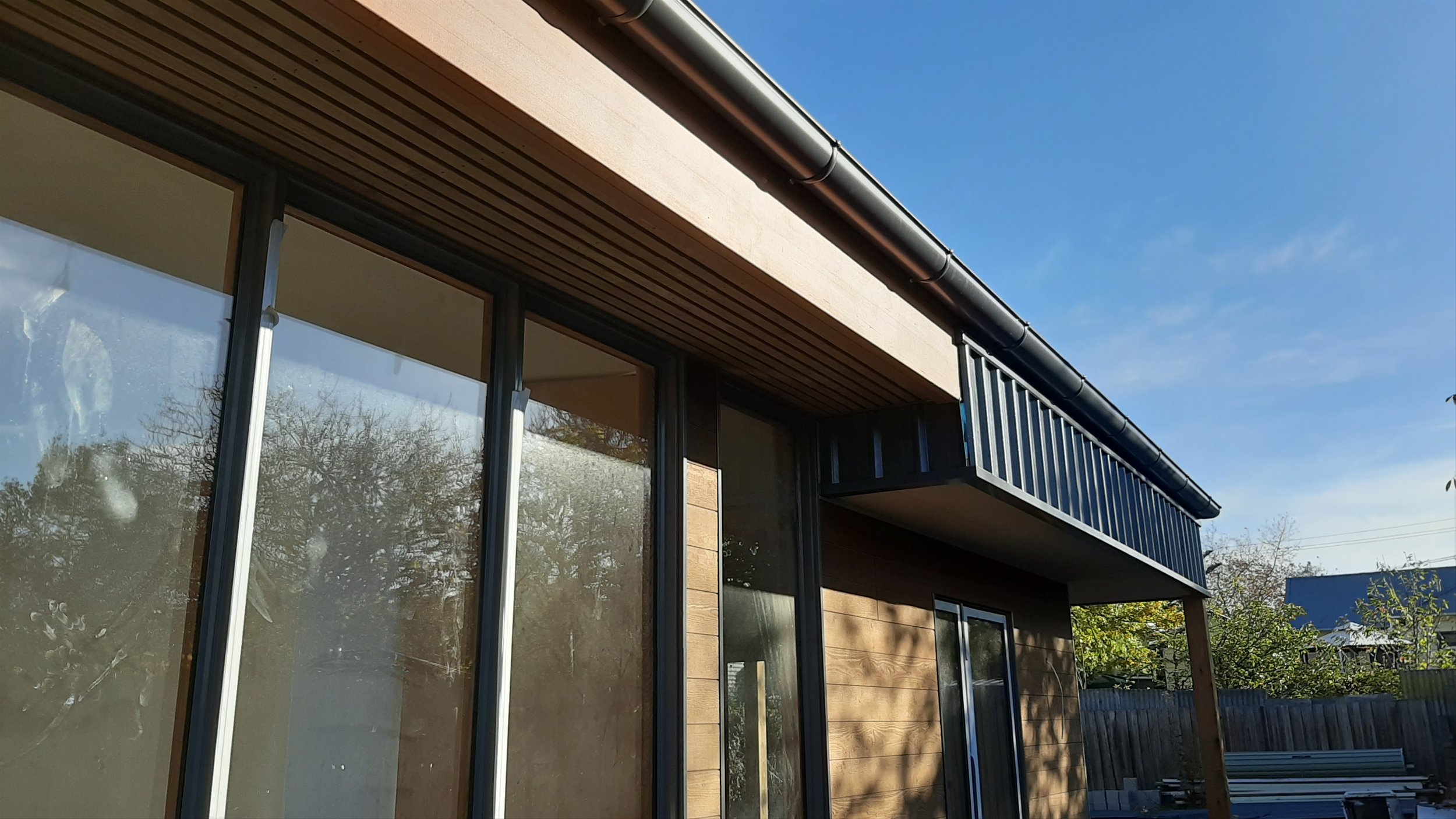  North facing window shading and roof ventilation grille. 