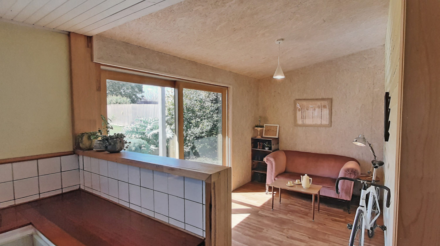 sun room with OSB lining, double-stud walls, solar gain, double-glazed sliding door
